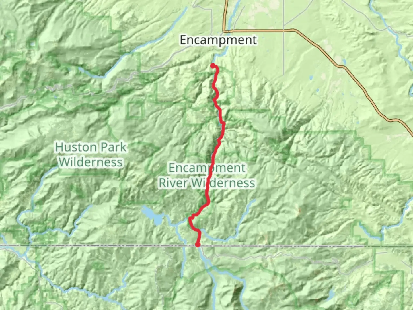An image depicting the trail Encampment River Trail and its surrounding area.