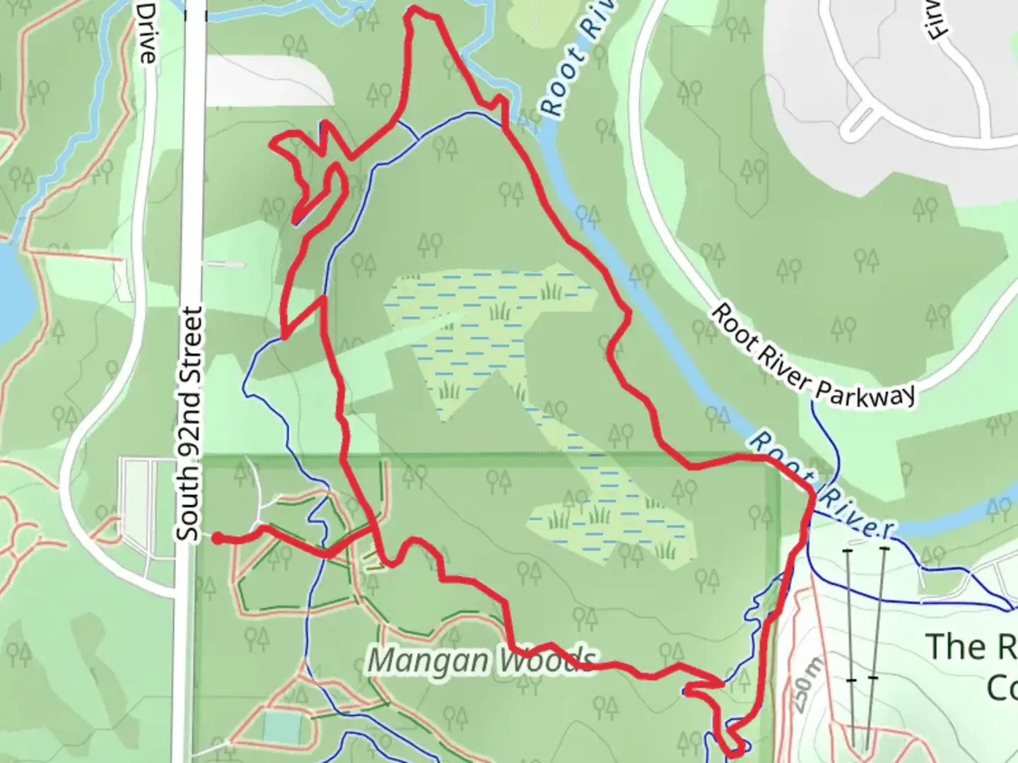 An image depicting the trail Mangan Woods Loop and its surrounding area.
