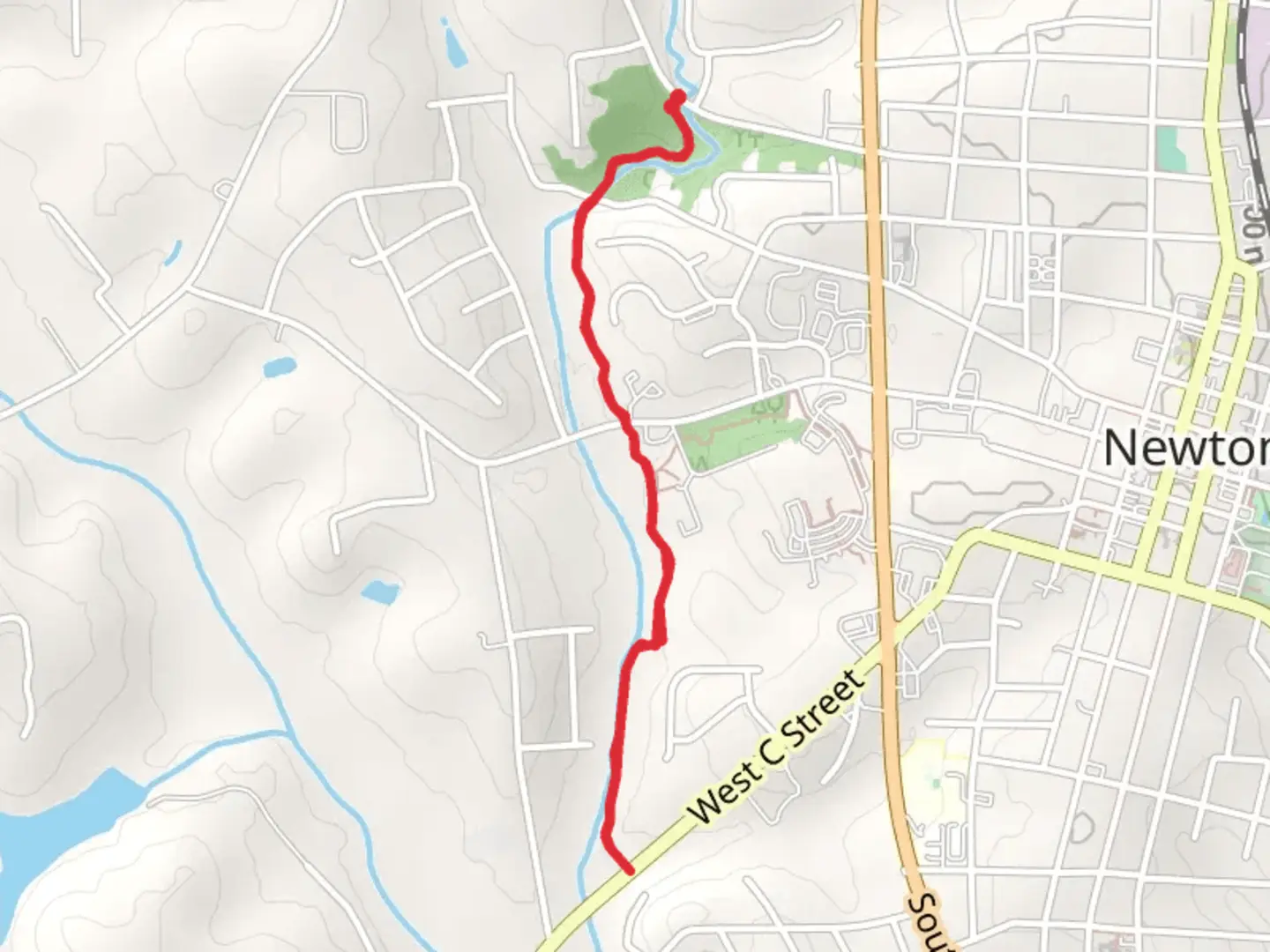 An image depicting the trail Newton Heritage Greenway and its surrounding area.