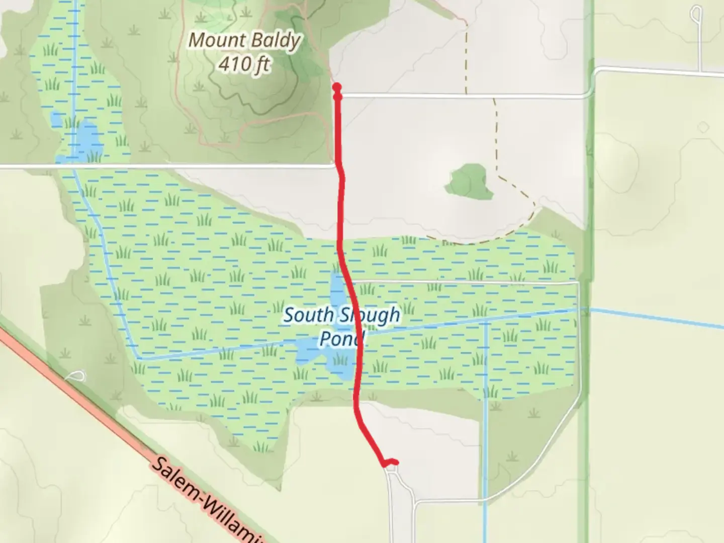 An image depicting the trail South Slough Pond from Coville Road and its surrounding area.