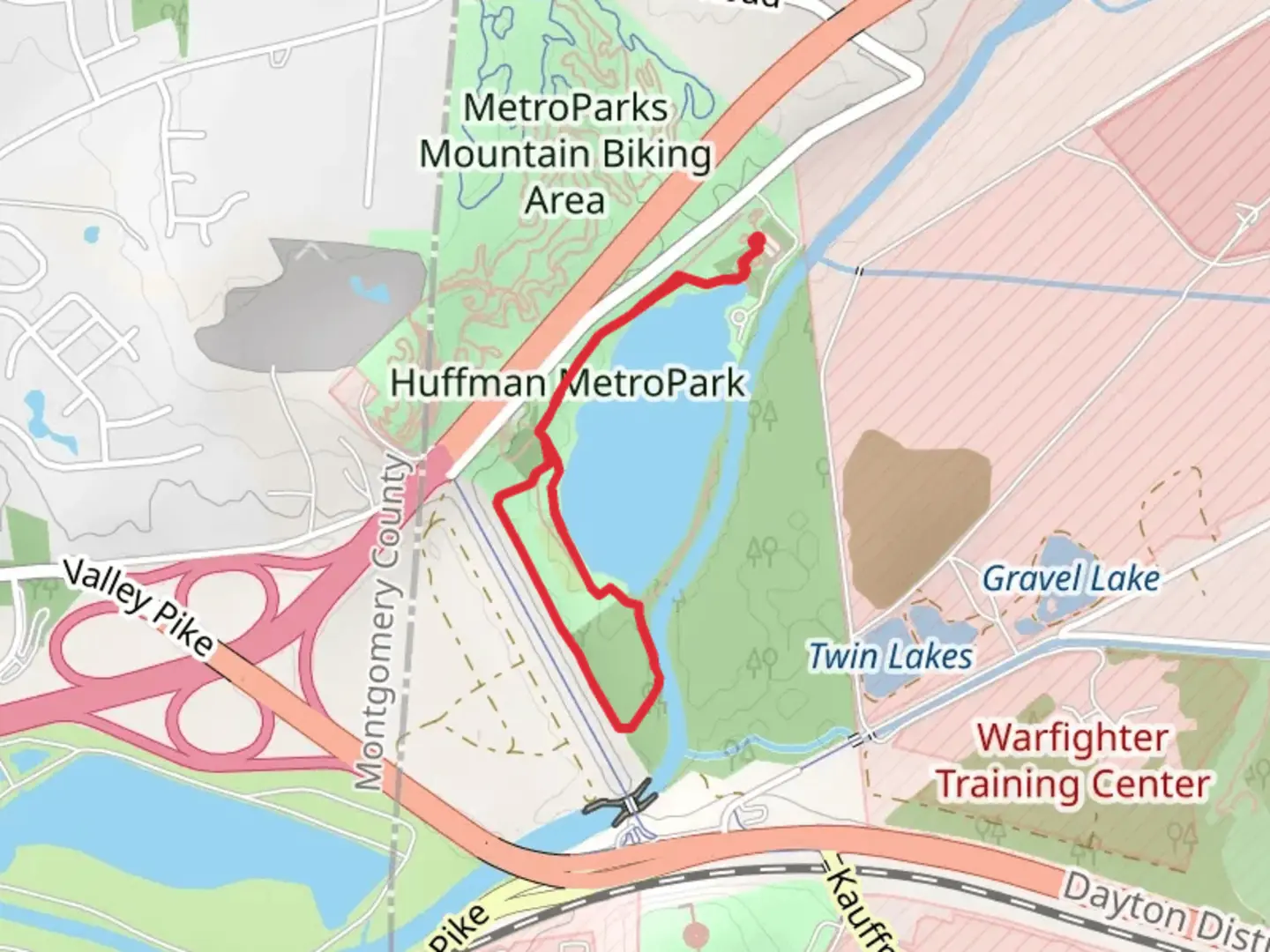 An image depicting the trail Walk beside Huffman MetroPark Lake and its surrounding area.