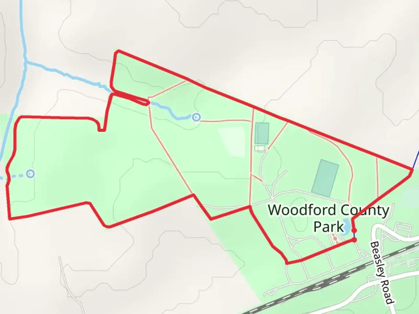 An image depicting the trail Woodford County Park Loop Trail and its surrounding area.