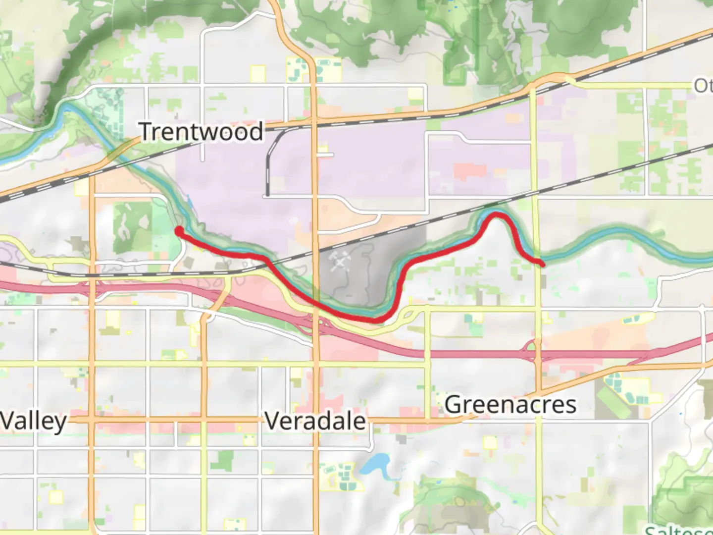 An image depicting the trail Spokane River Walk and its surrounding area.