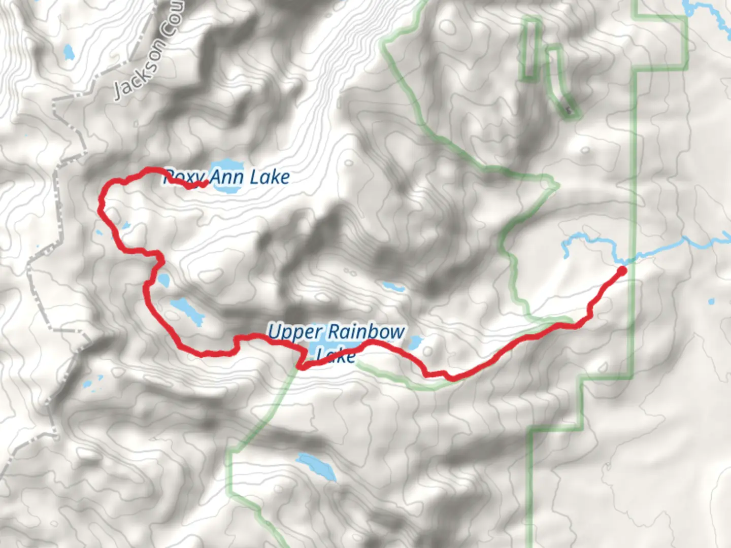 An image depicting the trail Roxy Ann Lake via Rainbow Lakes Trail and its surrounding area.