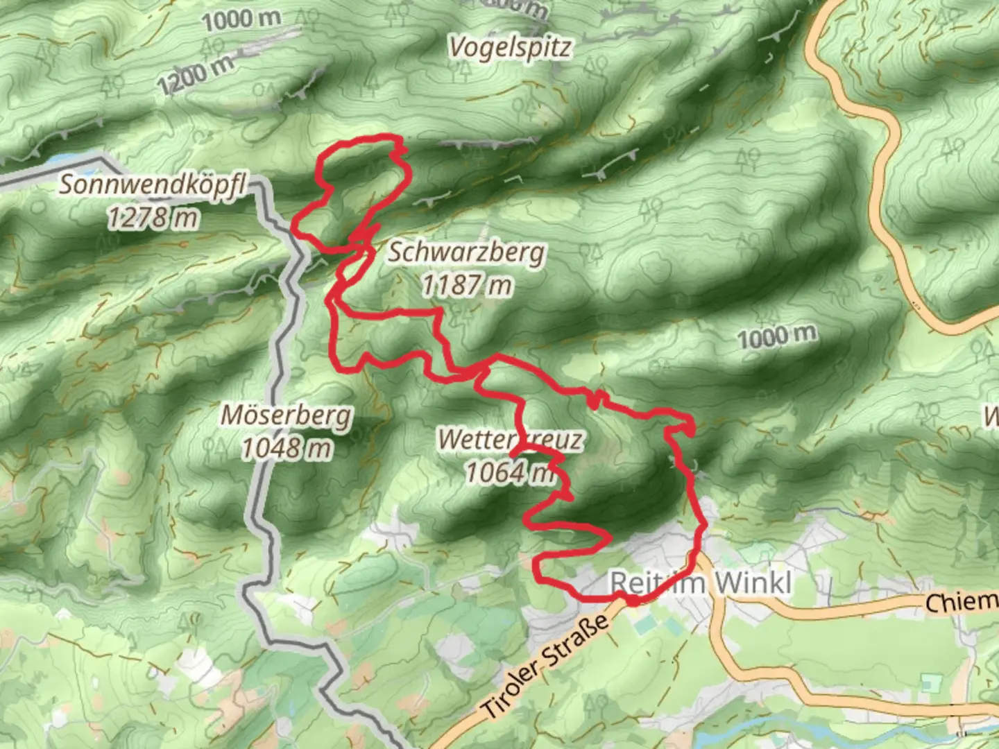 An image depicting the trail Wetterkreuz, Chiemsee Blick and Hausbachfall Loop - Reit im Winkl and its surrounding area.