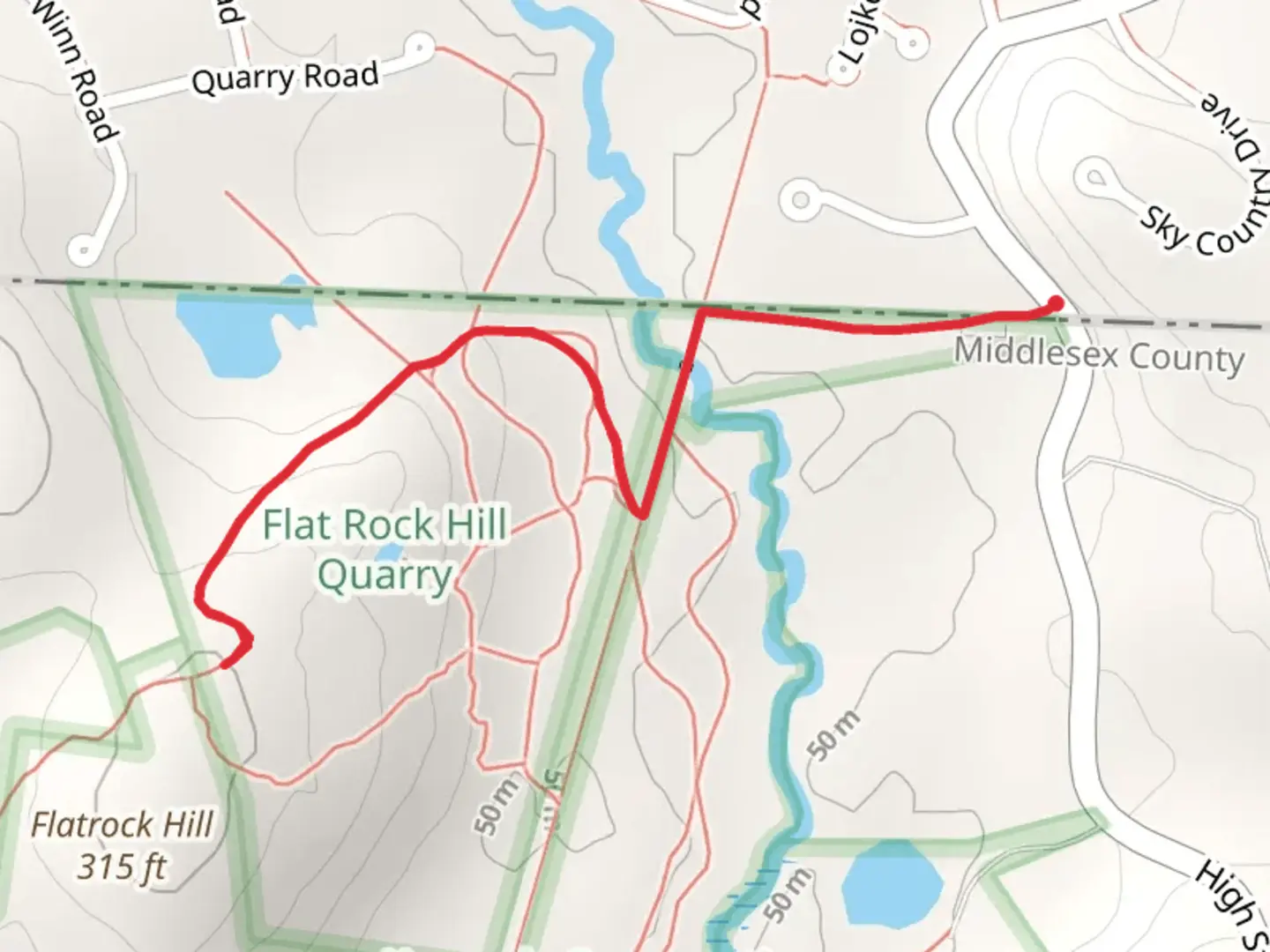 An image depicting the trail Flatrock Hill from Middle Dunstable Road and its surrounding area.