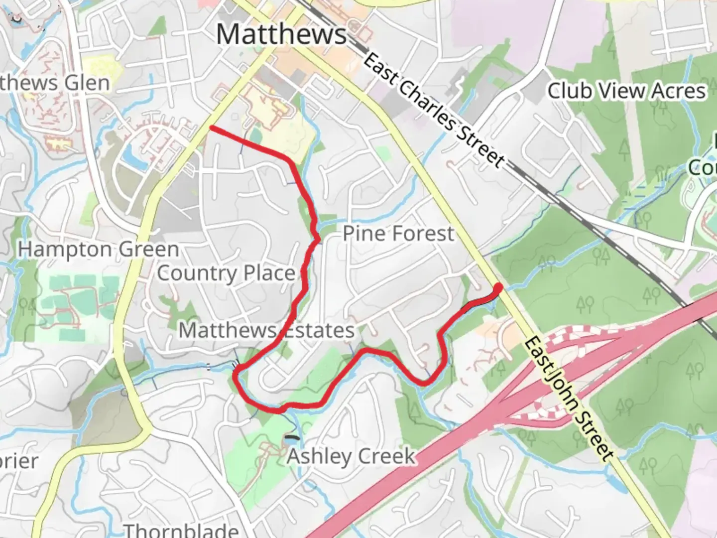 An image depicting the trail Four Mile Creek Greenway and its surrounding area.