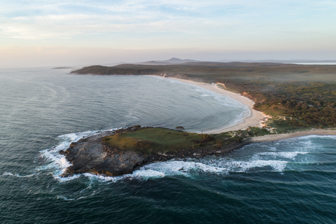 An image depicting the trail Angourie to Brooms Head Track and its surrounding area.