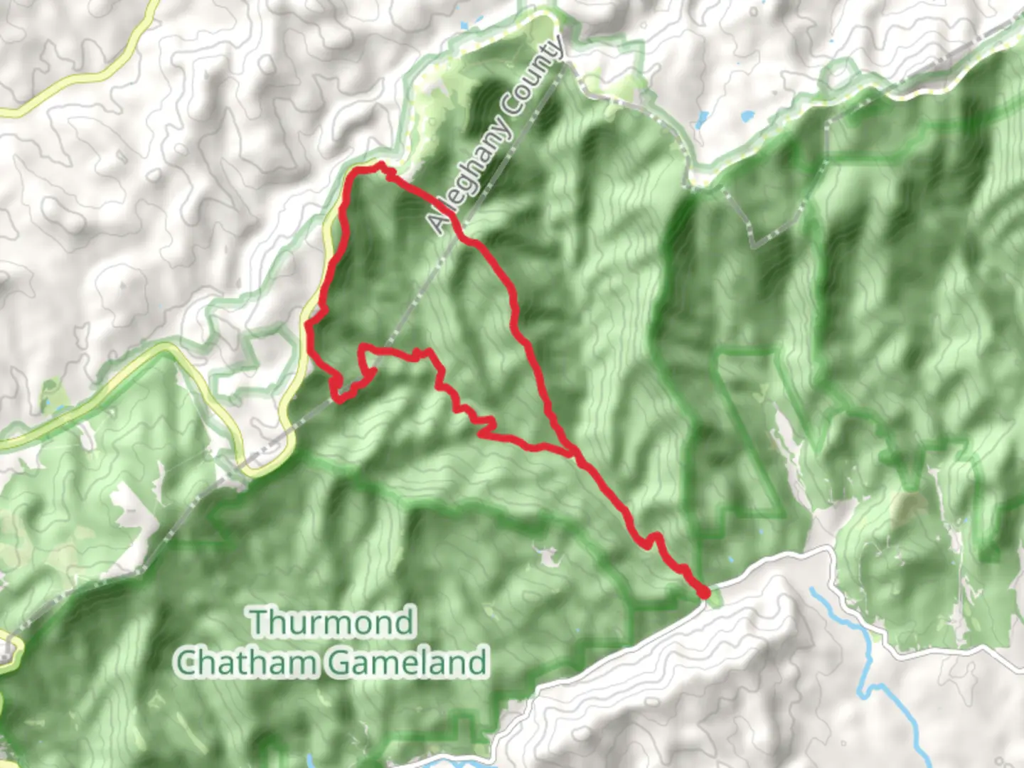 An image depicting the trail Bluff Mountain Loop via Grassy Gap Fire Road and its surrounding area.