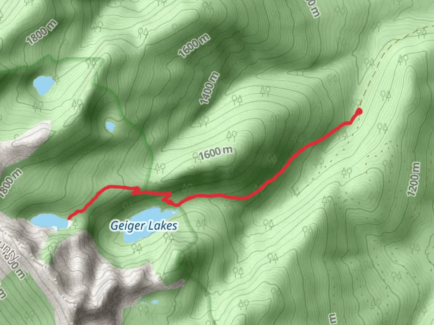 An image depicting the trail Upper Geiger Lake via Lake Creek Trail and its surrounding area.