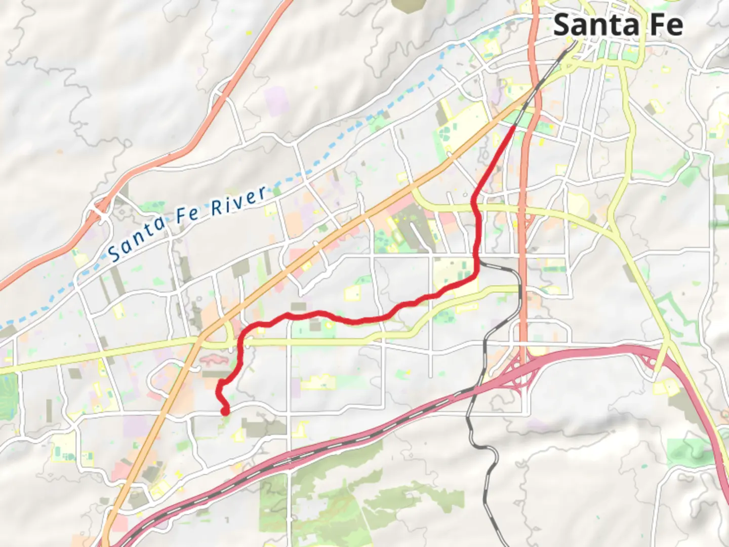 An image depicting the trail Arroyo de los Chamisos Trail and Santa Fe Rail Trail and its surrounding area.