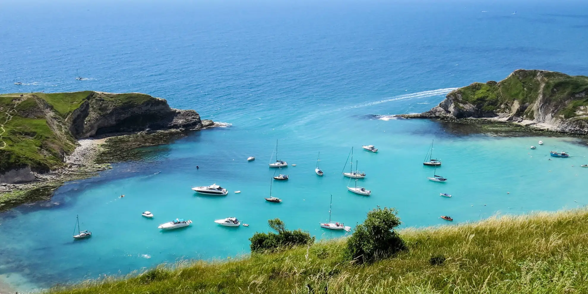 An image depicting the trail Durdle Door and White Nothe from Lulworth Cove and its surrounding area.