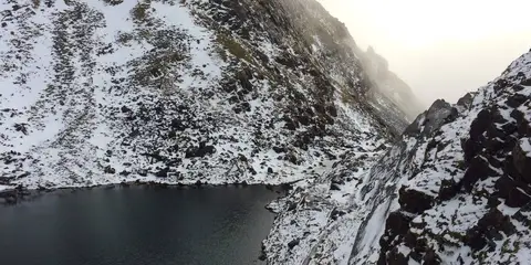 An image depicting the trail Carrauntoohil via O'Sheas Gully and its surrounding area.