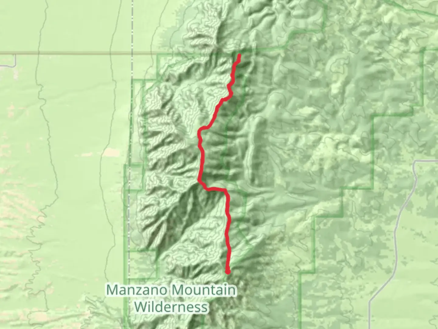An image depicting the trail Manzano Crest Trail from Capilla Peak and its surrounding area.
