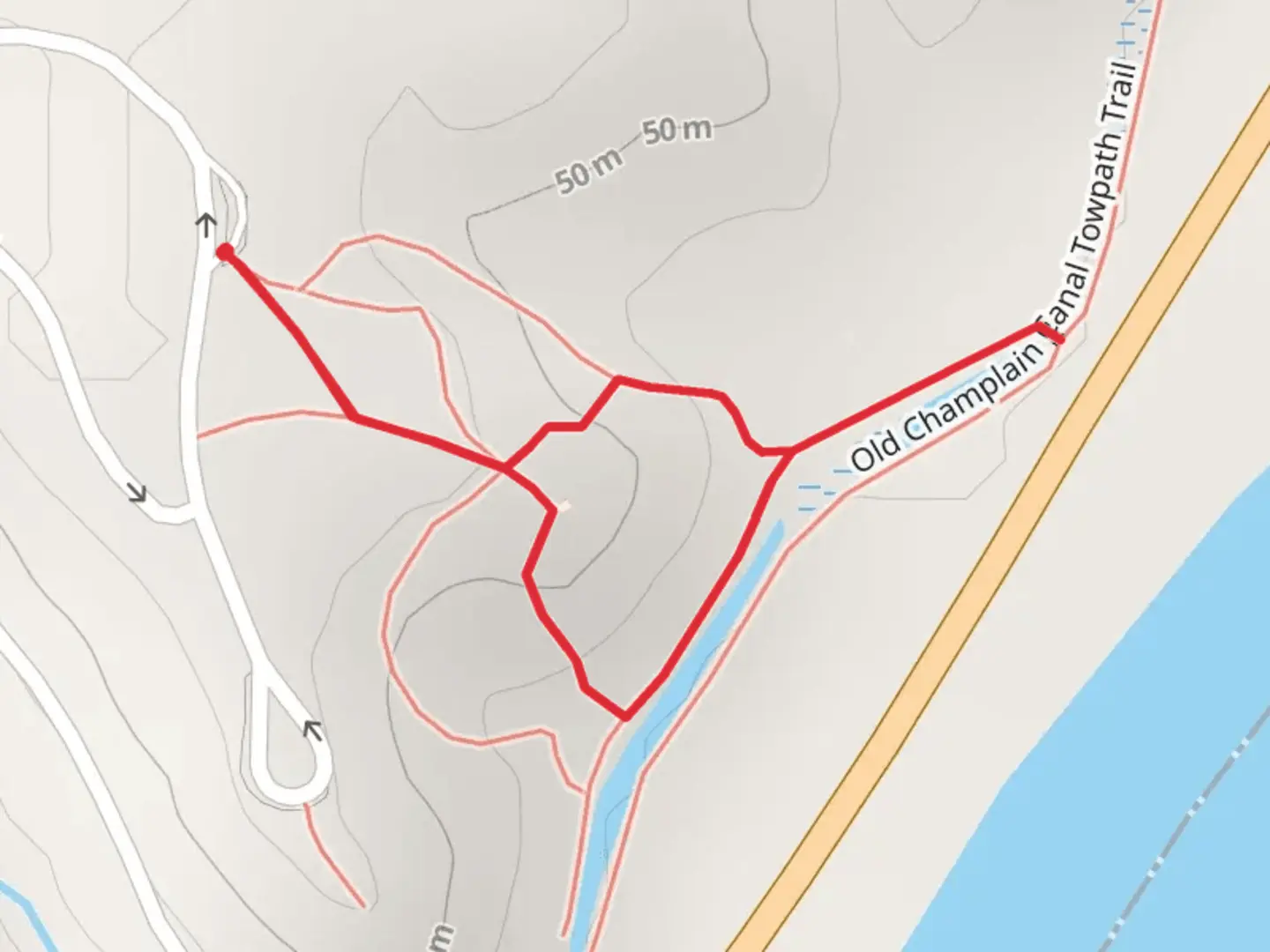 An image depicting the trail Old Champlain Canal from Saratoga National Battlefield Road and its surrounding area.