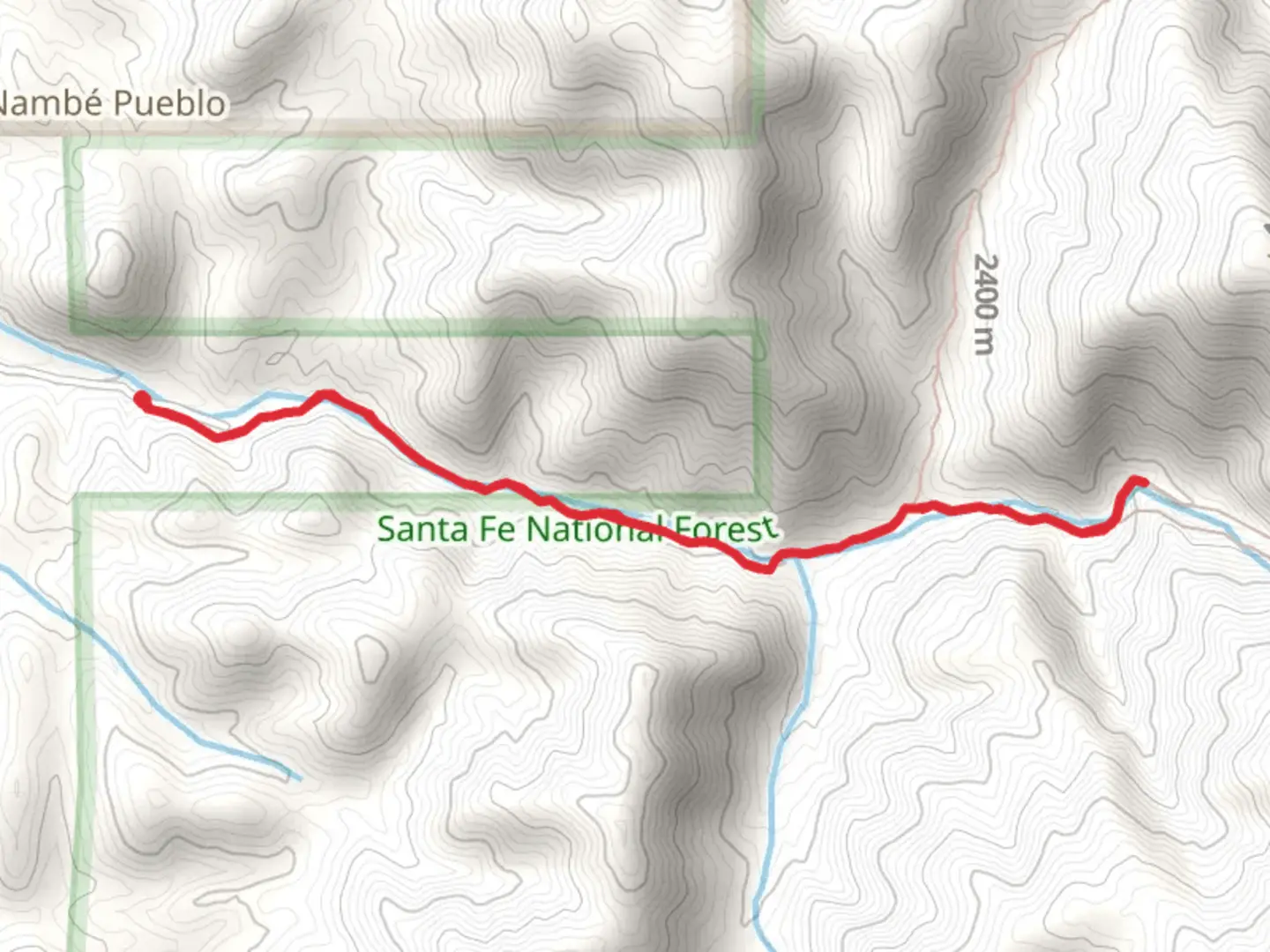 An image depicting the trail Rio en Medio Trail and its surrounding area.