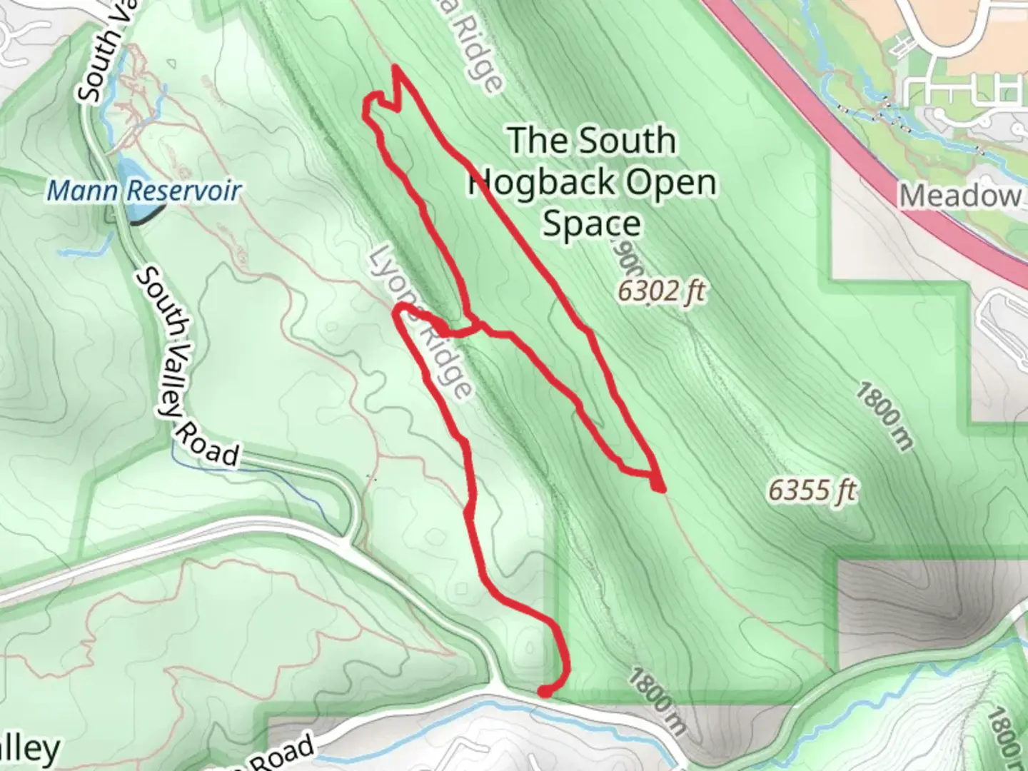 An image depicting the trail Coyote Song, Columbine and Cathy Johnson Loop Trail and its surrounding area.