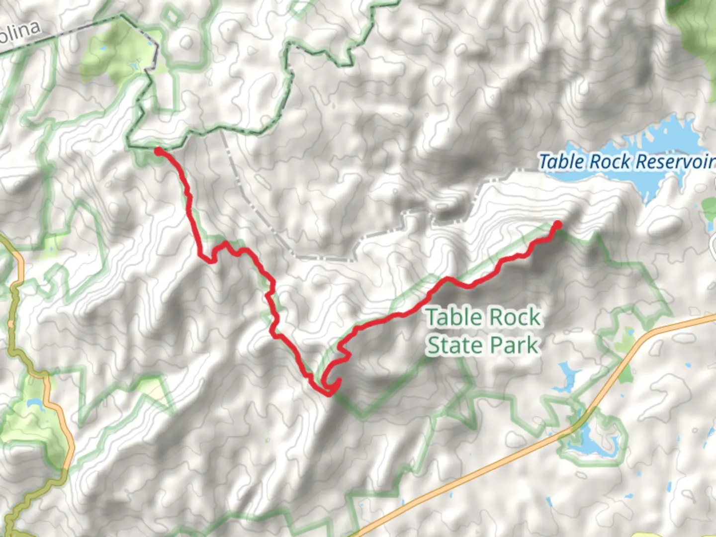 An image depicting the trail Table Rock and Hickorynut Mountain from Sassafras Mountain and its surrounding area.