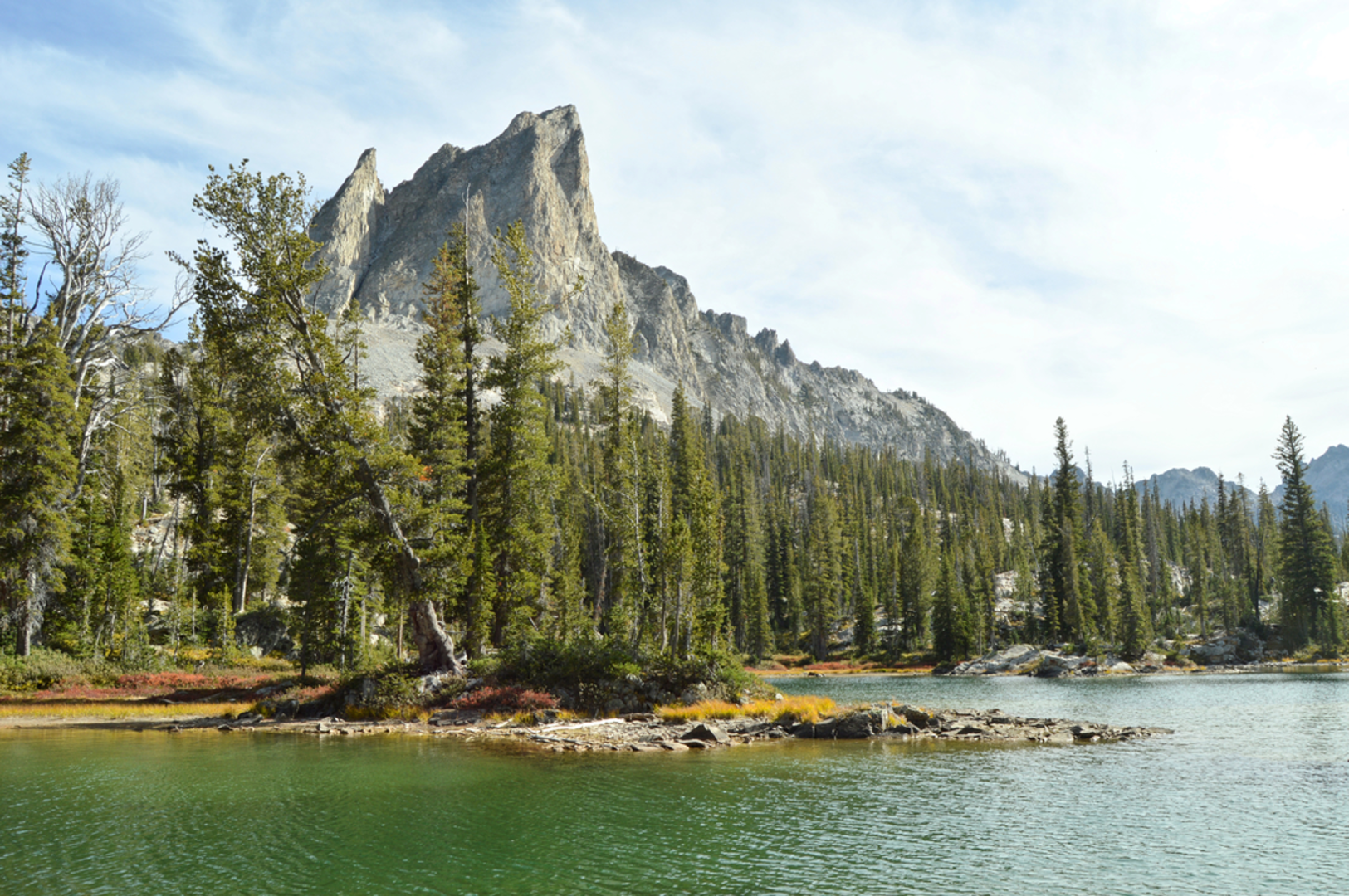 An image depicting the trail Alpine Lake via Stuart Fork Trail and its surrounding area.