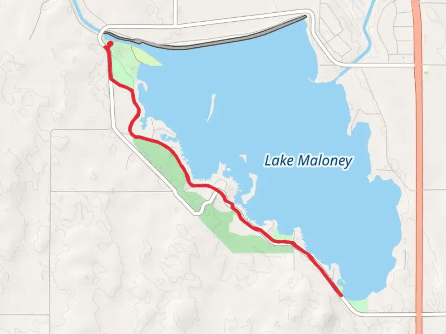 An image depicting the trail West Lake Road and Lake Maloney Trail and its surrounding area.
