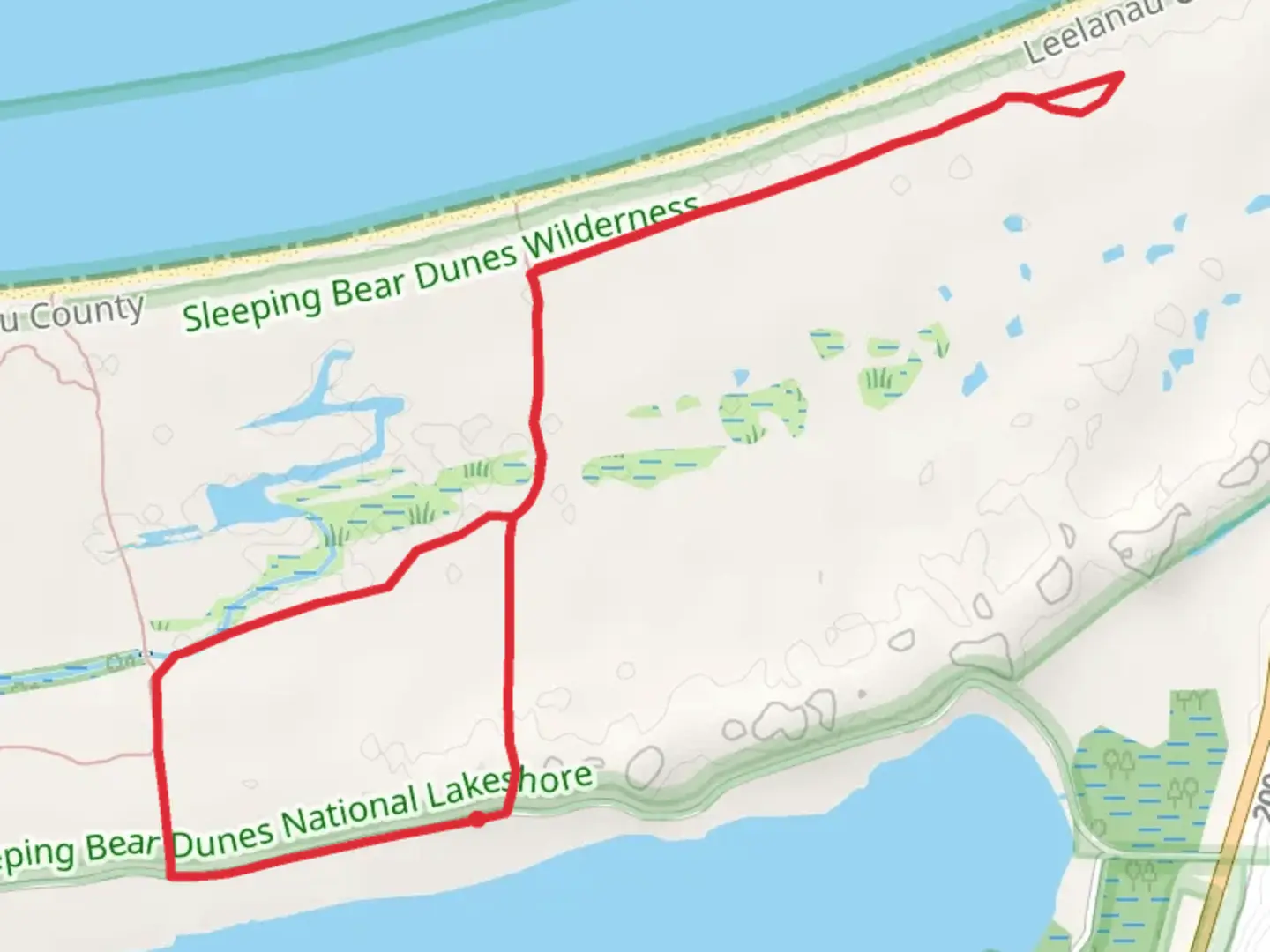 An image depicting the trail Good Harbor Bay Trail and Good Harbour Bay Beach Loop and its surrounding area.