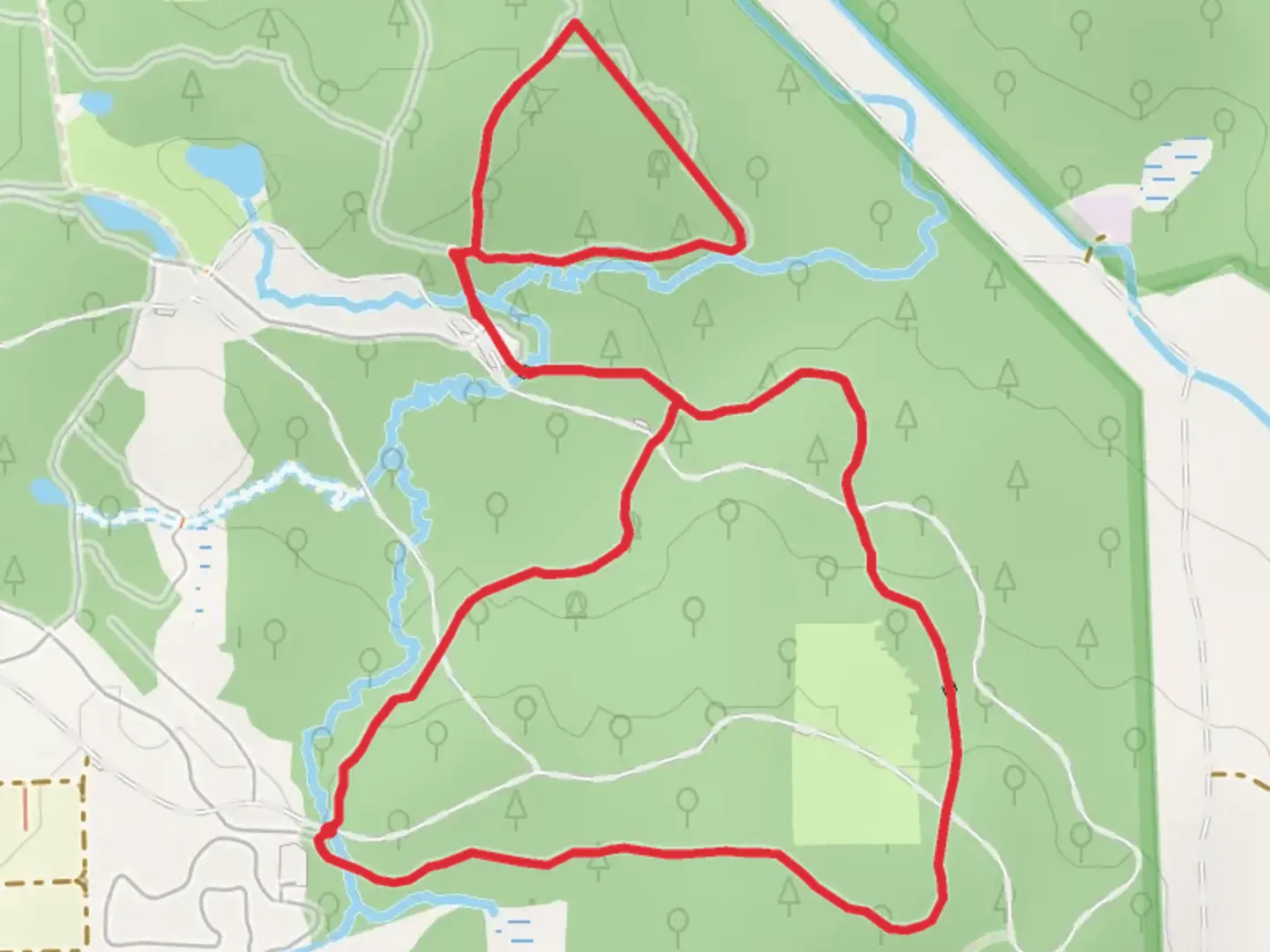 An image depicting the trail Woodland and Main Trail Loop - Spruce Point and its surrounding area.