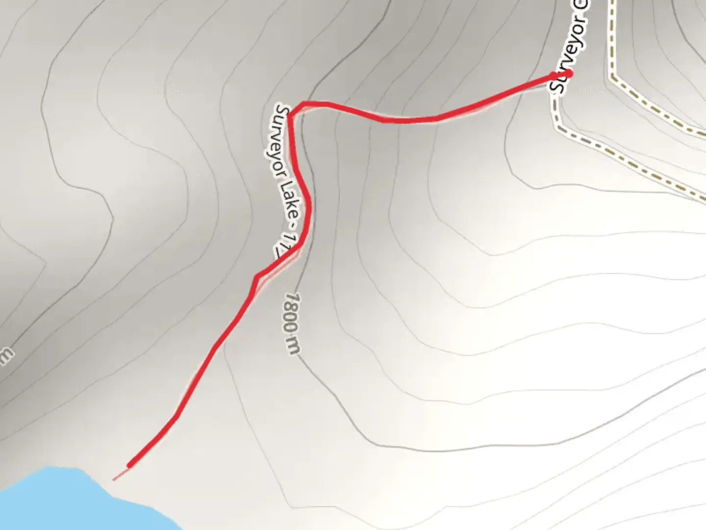 An image depicting the trail Surveyor Lake Trail and its surrounding area.