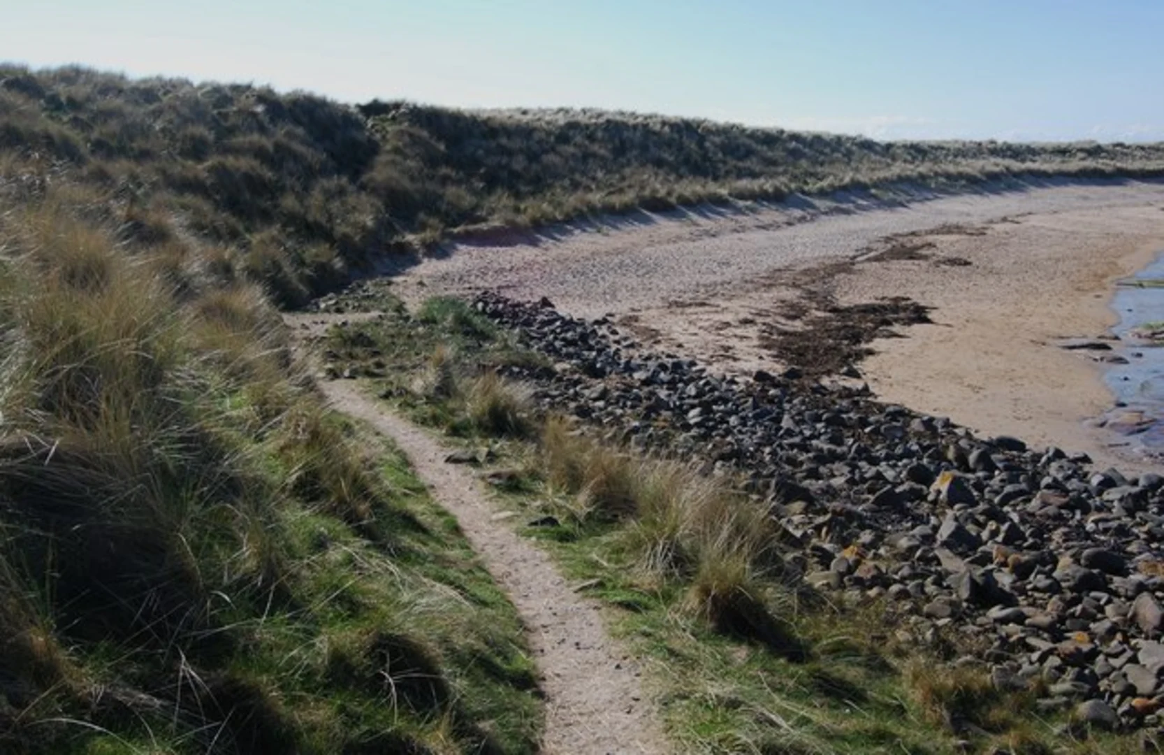 An image depicting the trail Craster to Low Newton by the Sea Walk via Dunstanburgh Castle and its surrounding area.