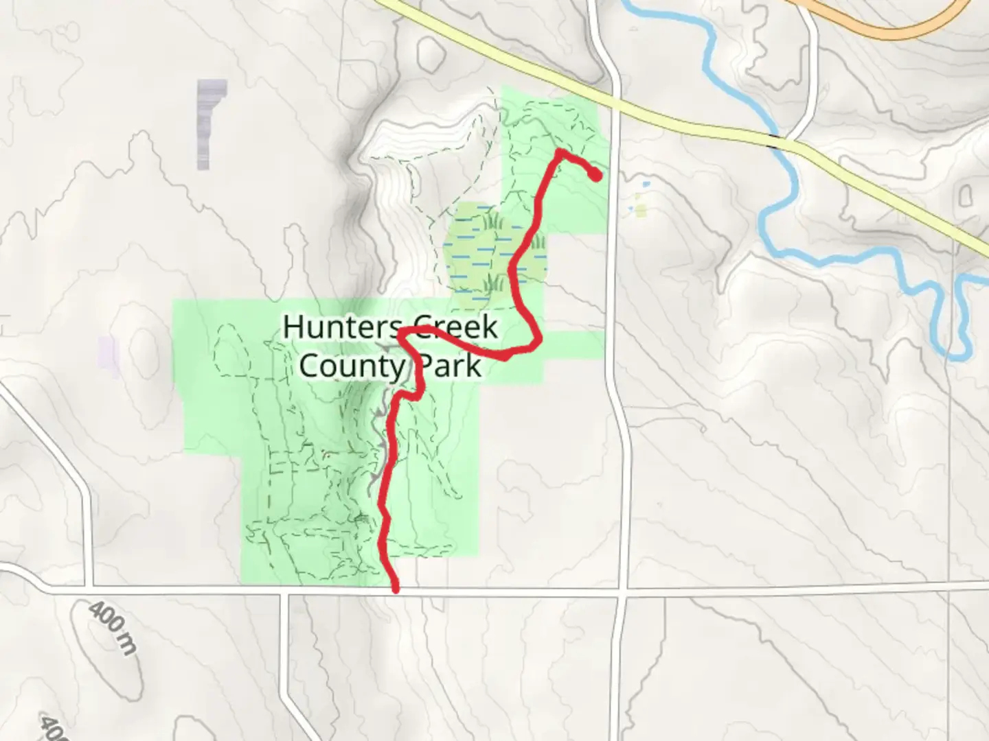 An image depicting the trail Hunters Creek County Park Trail and its surrounding area.