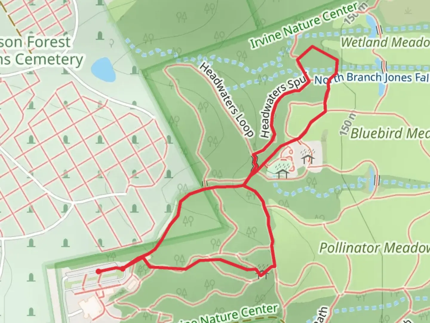 An image depicting the trail Caves Wood Road Loop and its surrounding area.