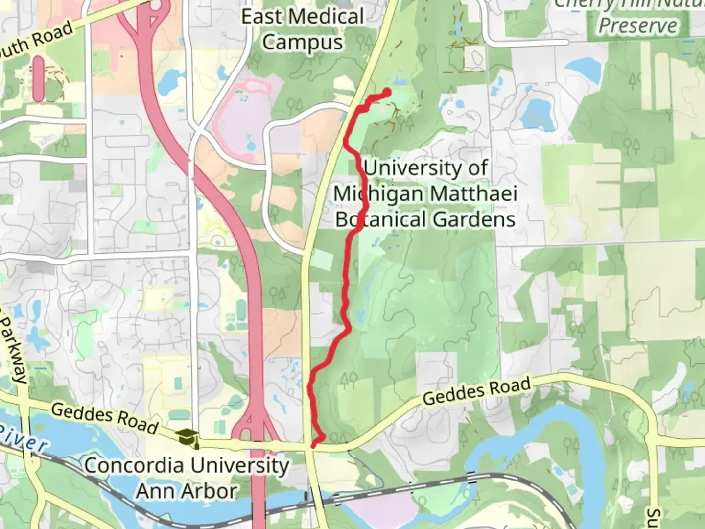 An image depicting the trail Matthaei Botanical Gardens Trail and its surrounding area.