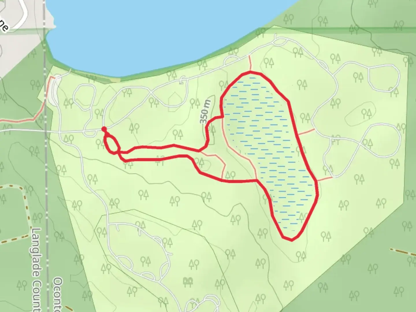 An image depicting the trail Boulder Lake CG Nature Loop Trail and its surrounding area.
