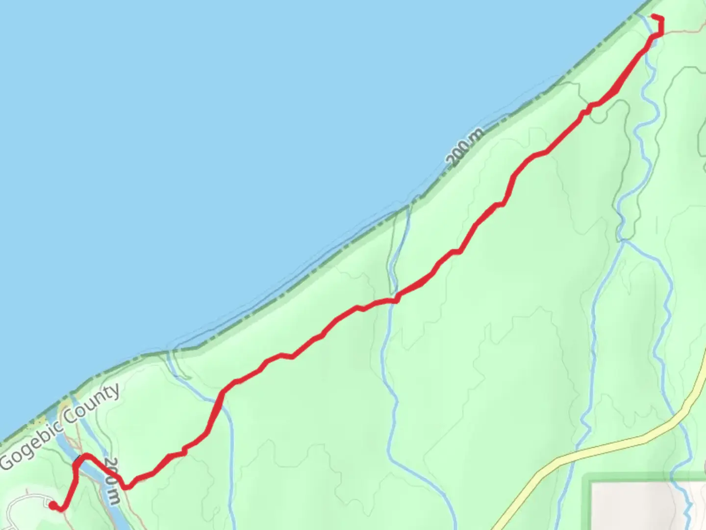An image depicting the trail Manabezho Falls and Lake Superior Trail and its surrounding area.