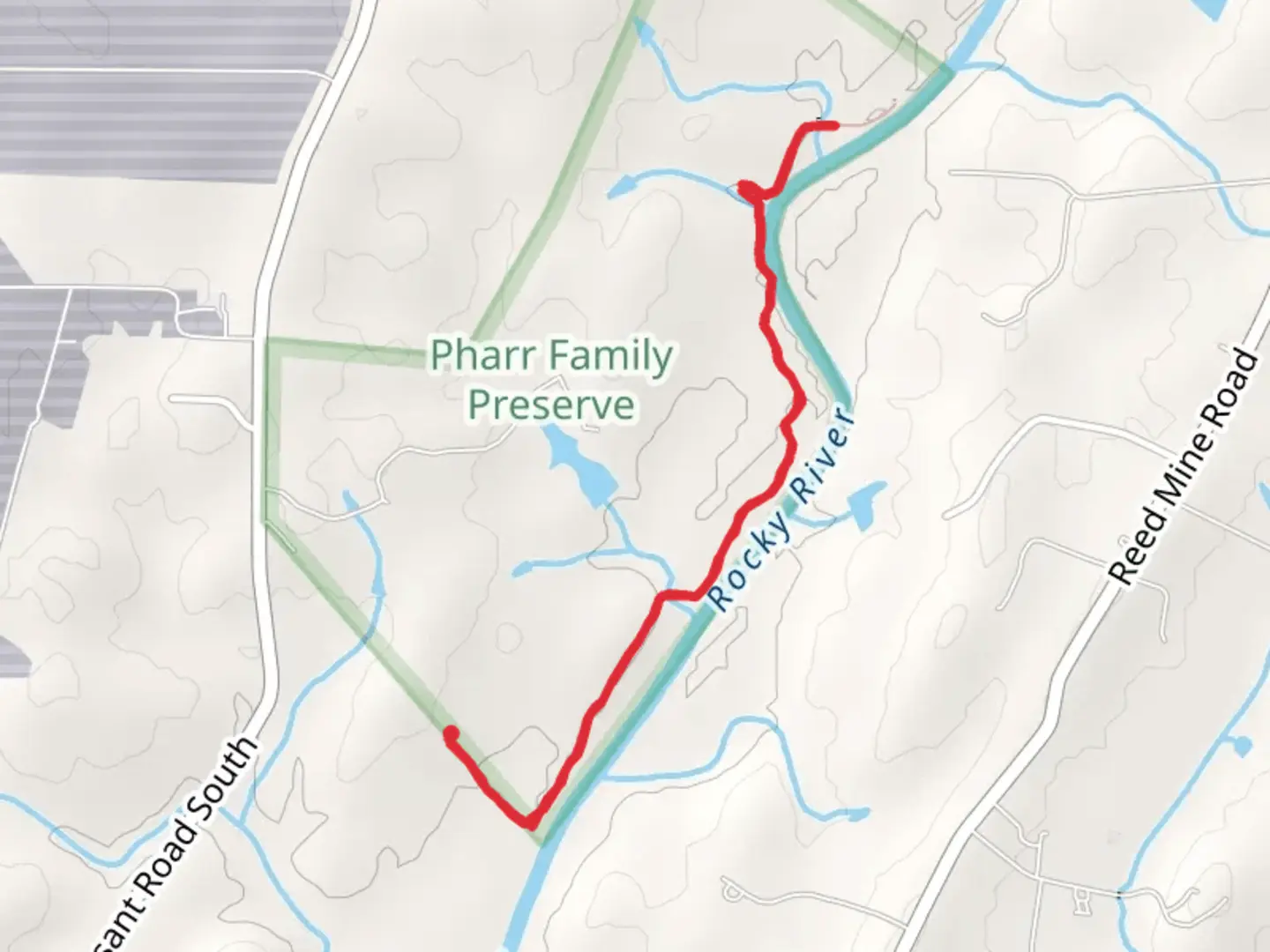 An image depicting the trail Pharr Family Perserve Trail and its surrounding area.