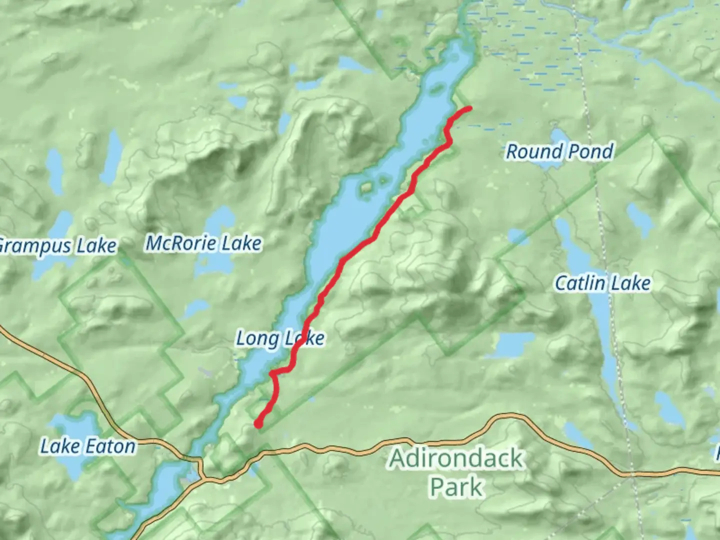 An image depicting the trail Along Raquette River and its surrounding area.