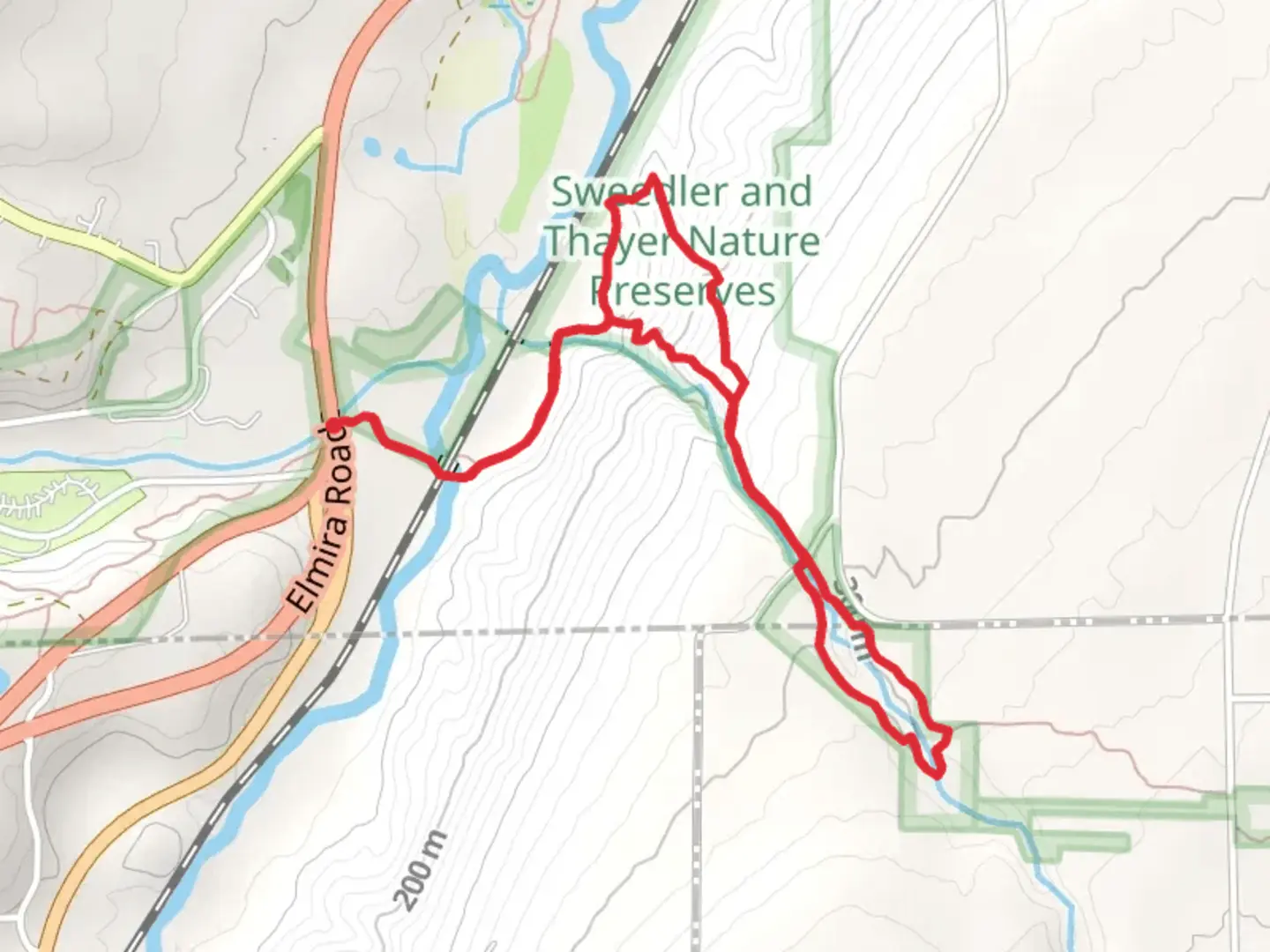 An image depicting the trail Lick Brook Loop Trail from Elmira Road and its surrounding area.