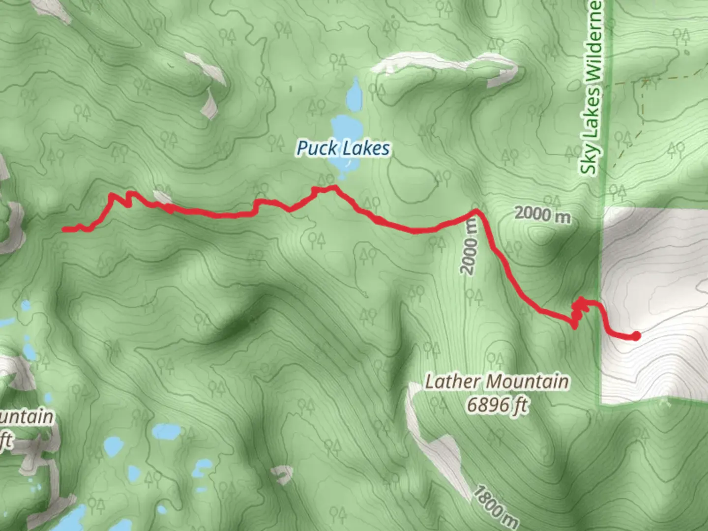 An image depicting the trail Puck Lakes via Snow Lakes Trail and its surrounding area.