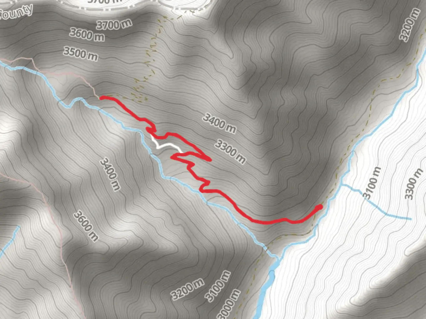 An image depicting the trail Basin Creek Trail and its surrounding area.
