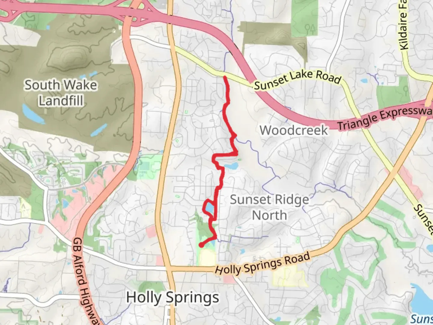 An image depicting the trail Holly Springs Greenway Trail and its surrounding area.