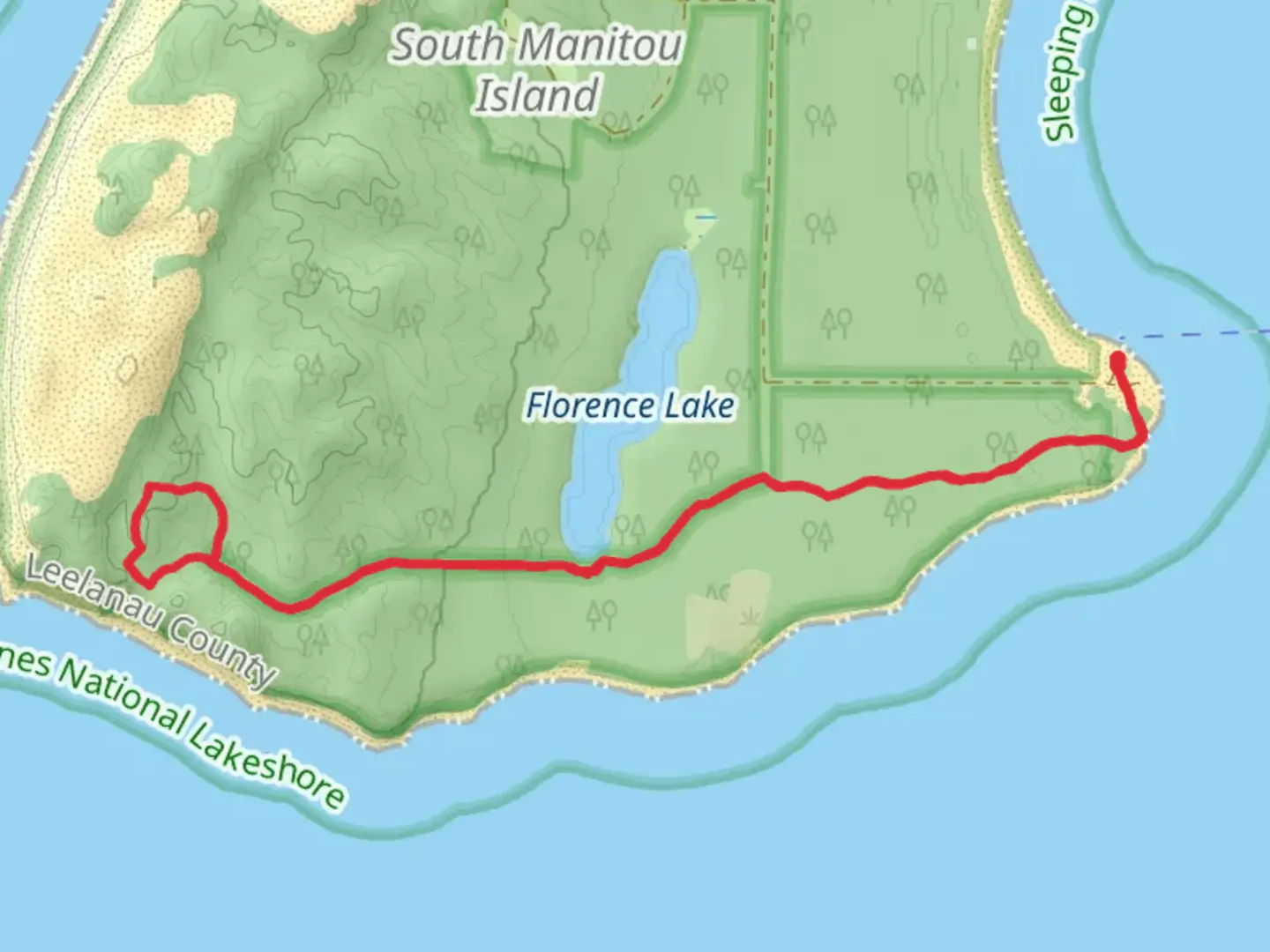 An image depicting the trail Valley of the Giants and South Manitou Island Lighthouse Walk and its surrounding area.