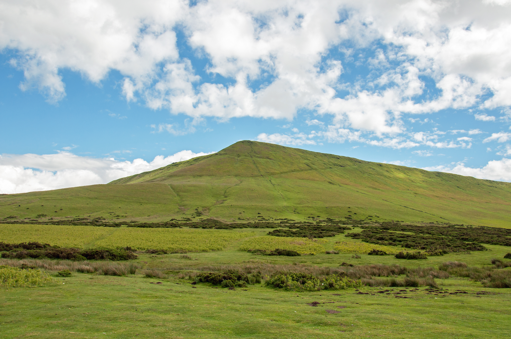An image depicting the trail Hay Bluff and Twmpa from Capel-y-Ffin and its surrounding area.