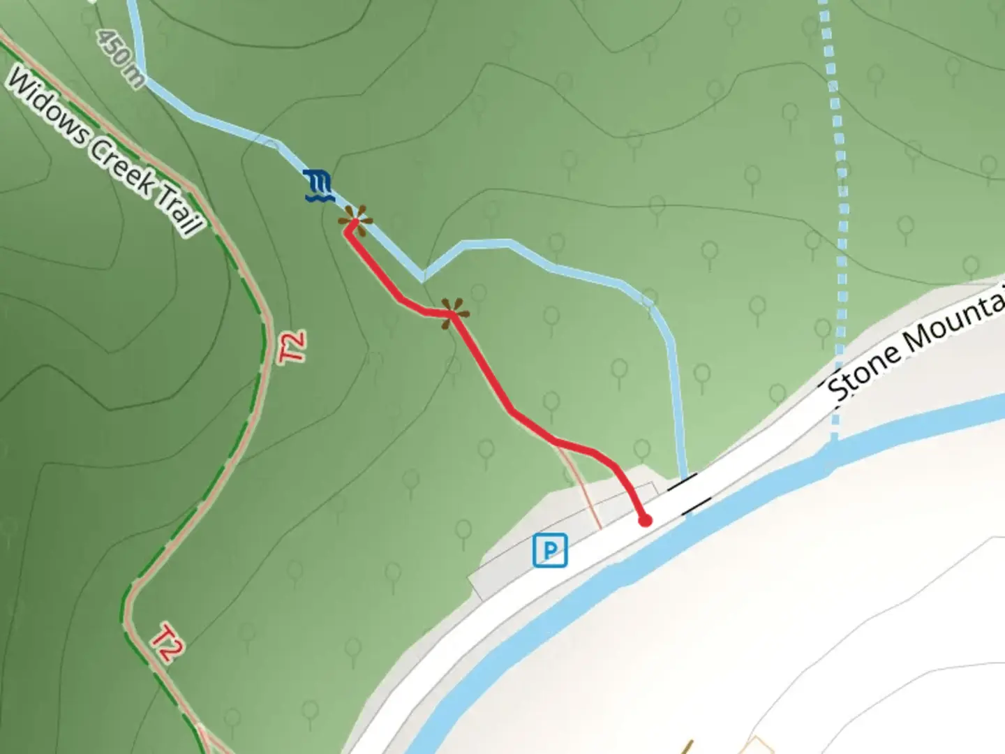 An image depicting the trail Widows Falls and its surrounding area.
