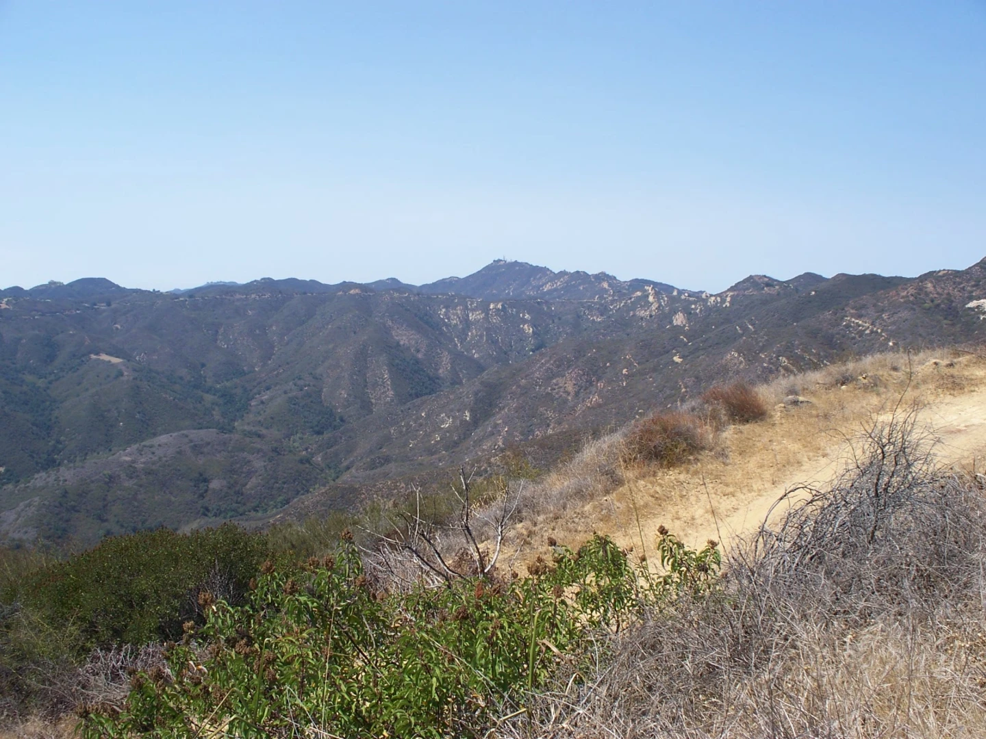 An image depicting the trail Mesa Peak and McAuley Peak via Backbone Trail and its surrounding area.