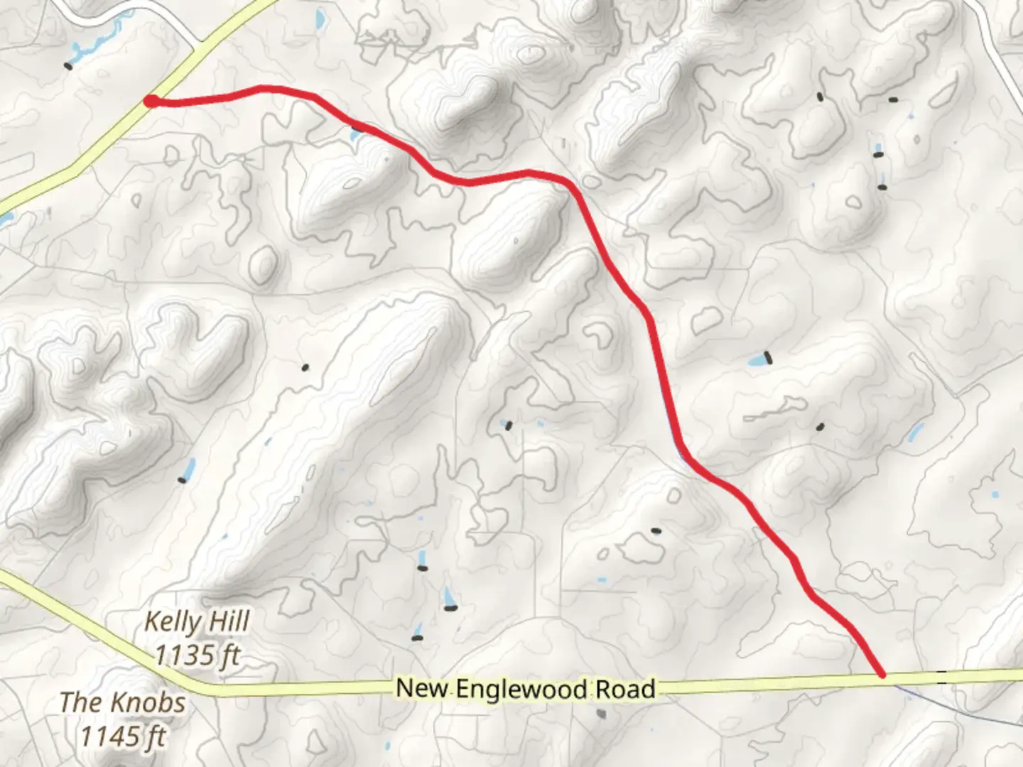An image depicting the trail Old Athens Madisonville Road and its surrounding area.