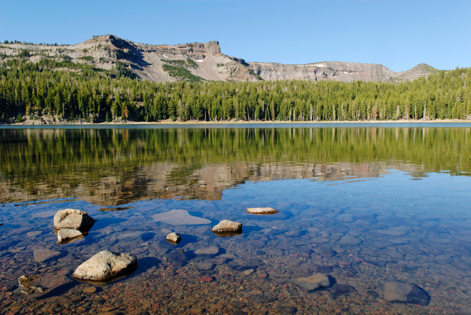 An image depicting the trail Little Three Creek Lake via Driftwood Trail and its surrounding area.