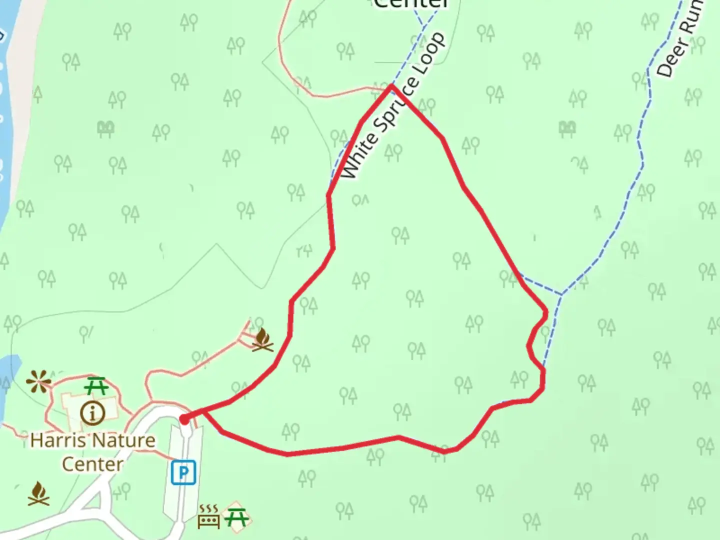 An image depicting the trail Harris Nature Center - White Spruce Loop and its surrounding area.