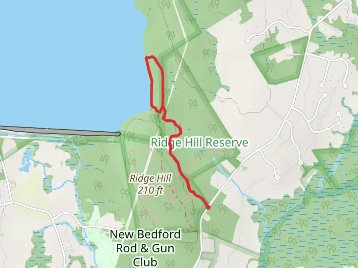 An image depicting the trail Red Trail to Copicut Reservoir Trail - Collins Corner Road and its surrounding area.