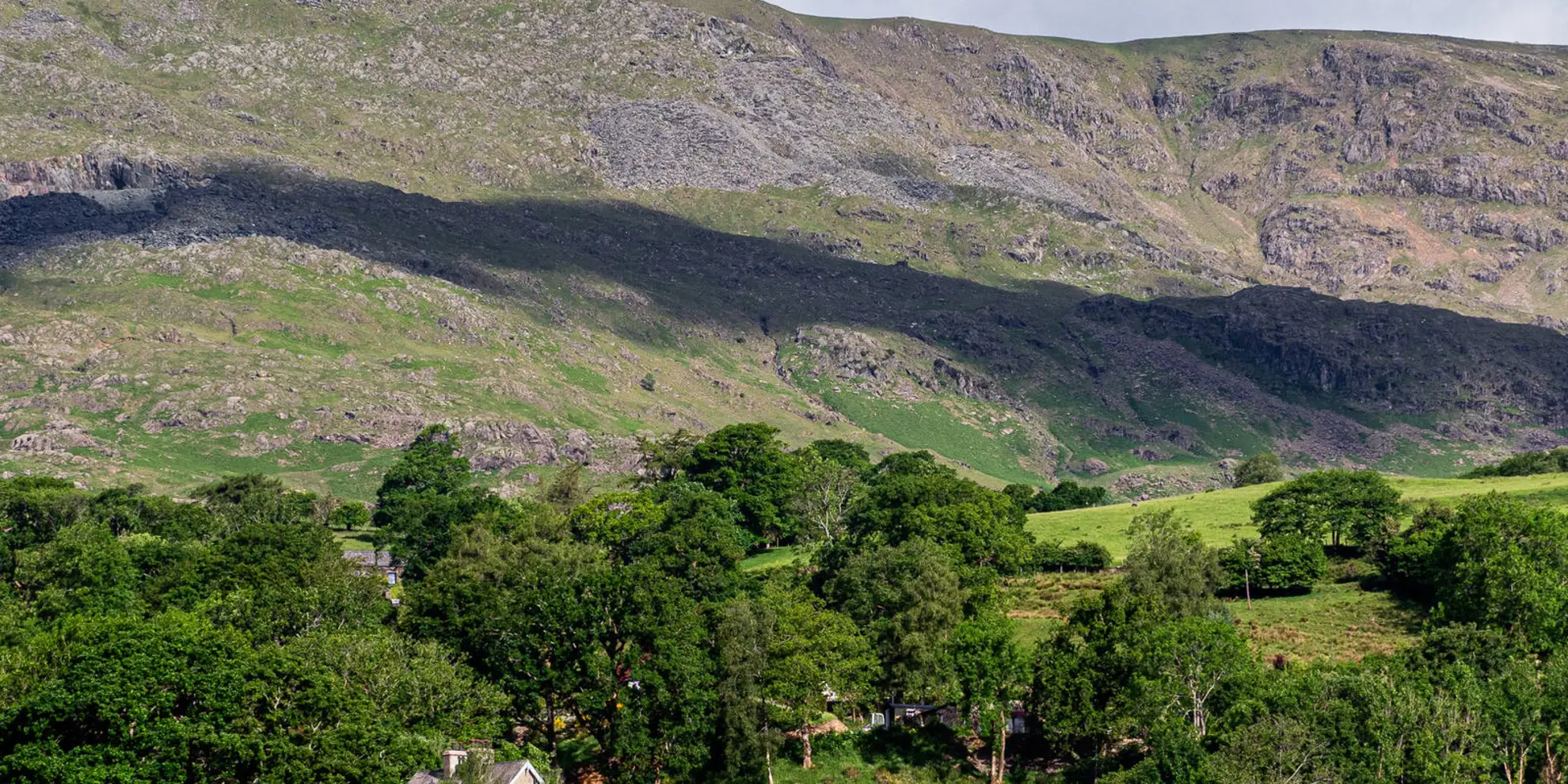An image depicting the trail The Old Man of Coniston from Coniston village and its surrounding area.