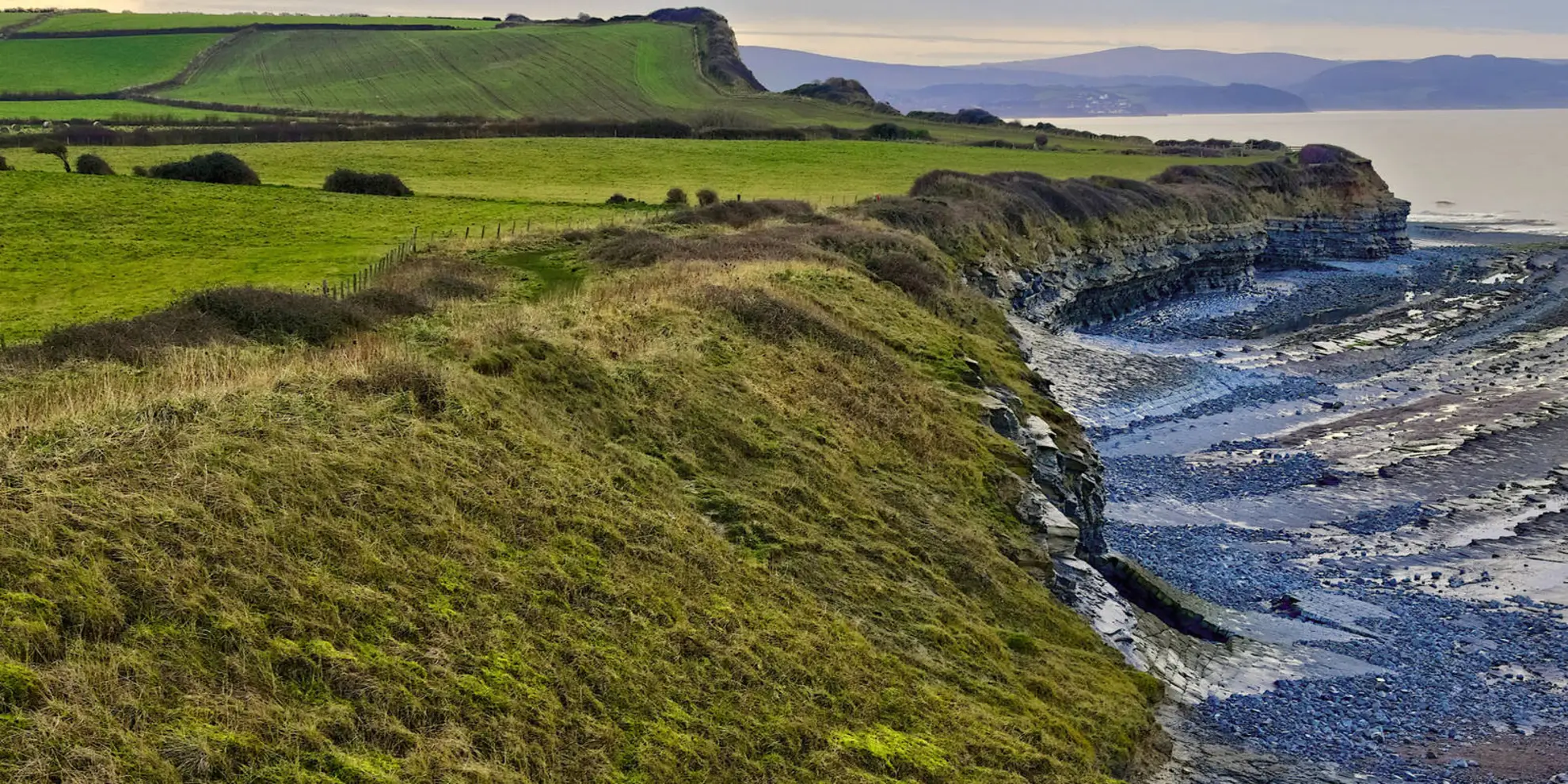 An image depicting the trail Beacon Hill and Bicknoller Post from Kilve Beach and its surrounding area.