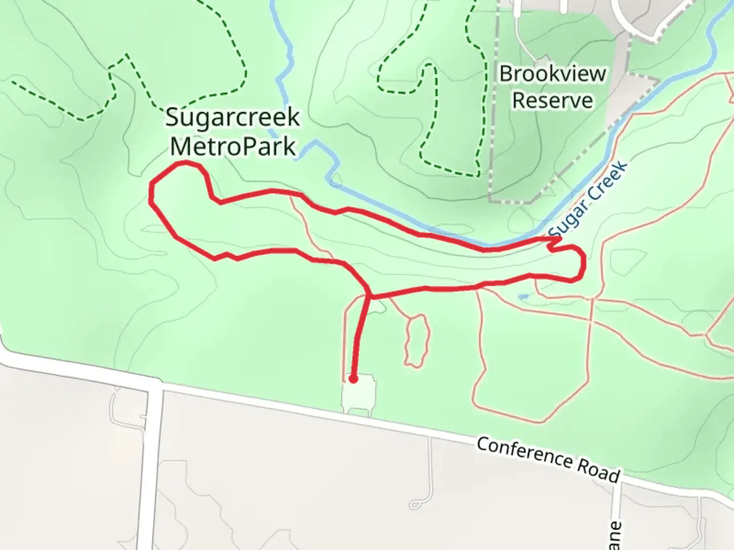 An image depicting the trail Sugarcreek MetroPark Green Loop Trail and its surrounding area.